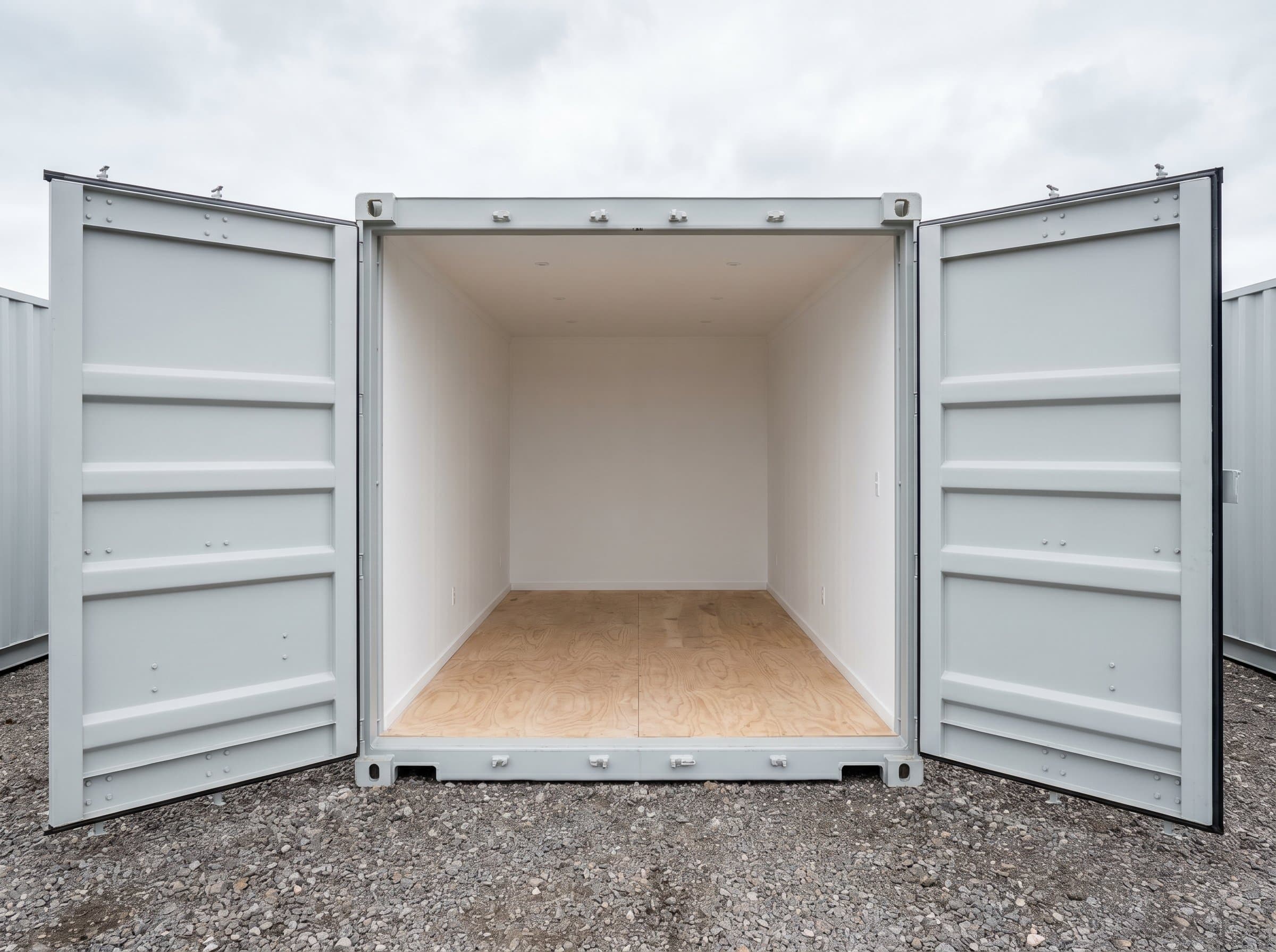 Pristine brand-new 20ft one-trip shipping container with cargo doors fully open, revealing immaculate factory-fresh interior