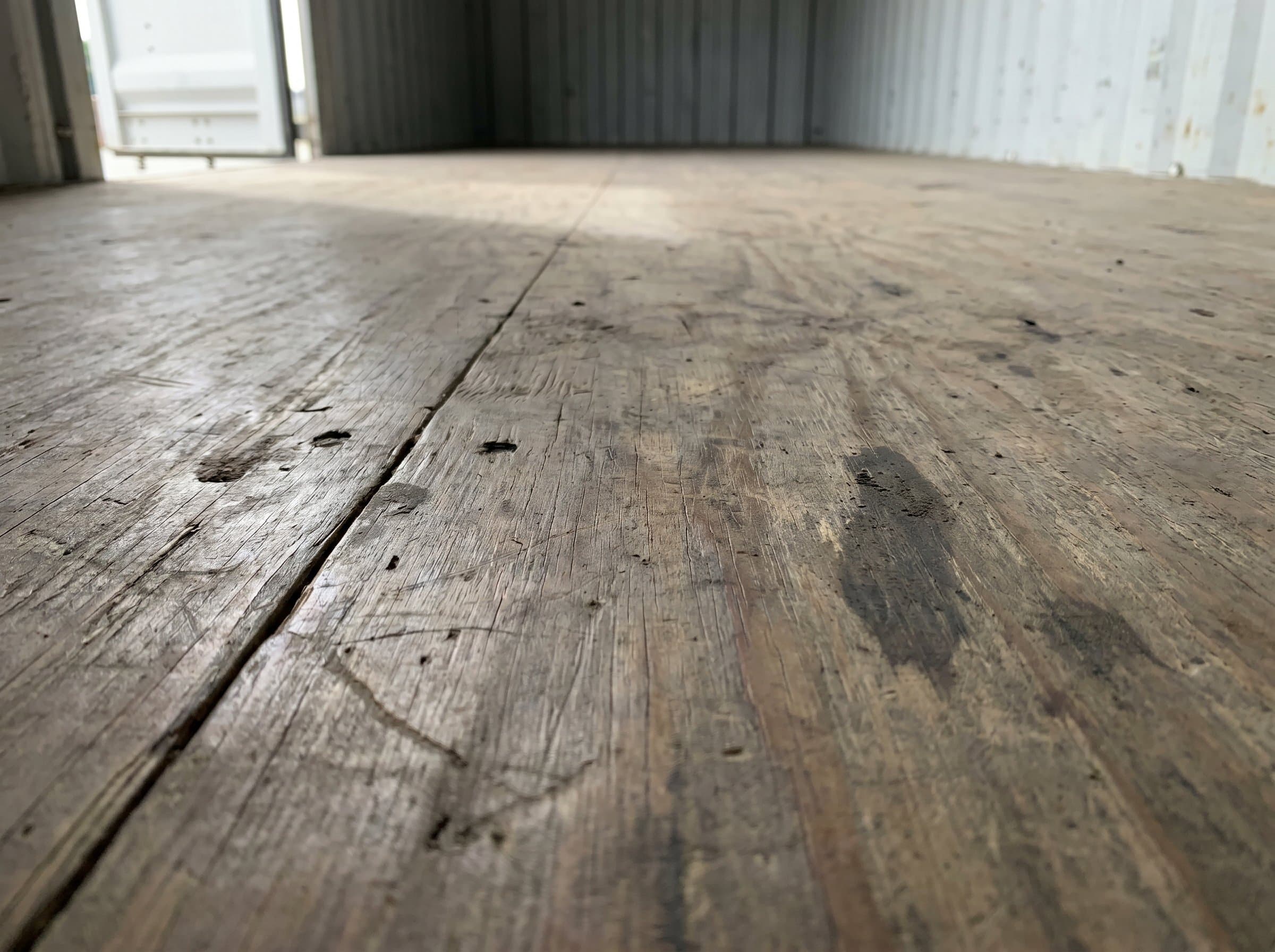 Close-up of marine-grade plywood floor inside a 40ft high-cube used wind-and-watertight shipping container